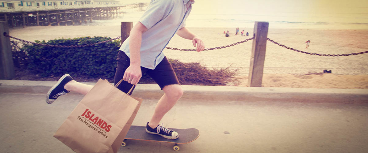 Skateboarder Holding Take Out Bag